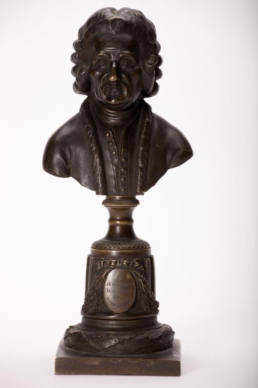 FRENCH BRONZE BUST OF JEAN-JACQUES ROUSSEAU: On an elaborate column base with two plaques inscribed "JJ Rousseau Ne le 28 Avril, 1712" and "Fait Par Menier", beautifully patinated, late 18th/early 19th century. H 25 cm. (10 in.)