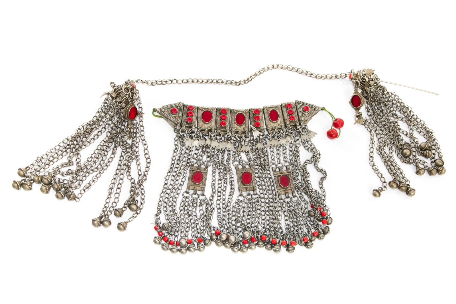 VINTAGE TURKMEN BIB NECKLACE AND FIBULAE: Embossed silvered necklace with red glass and stone inserts, with long tassels and rope closure; together with matching fibulae.