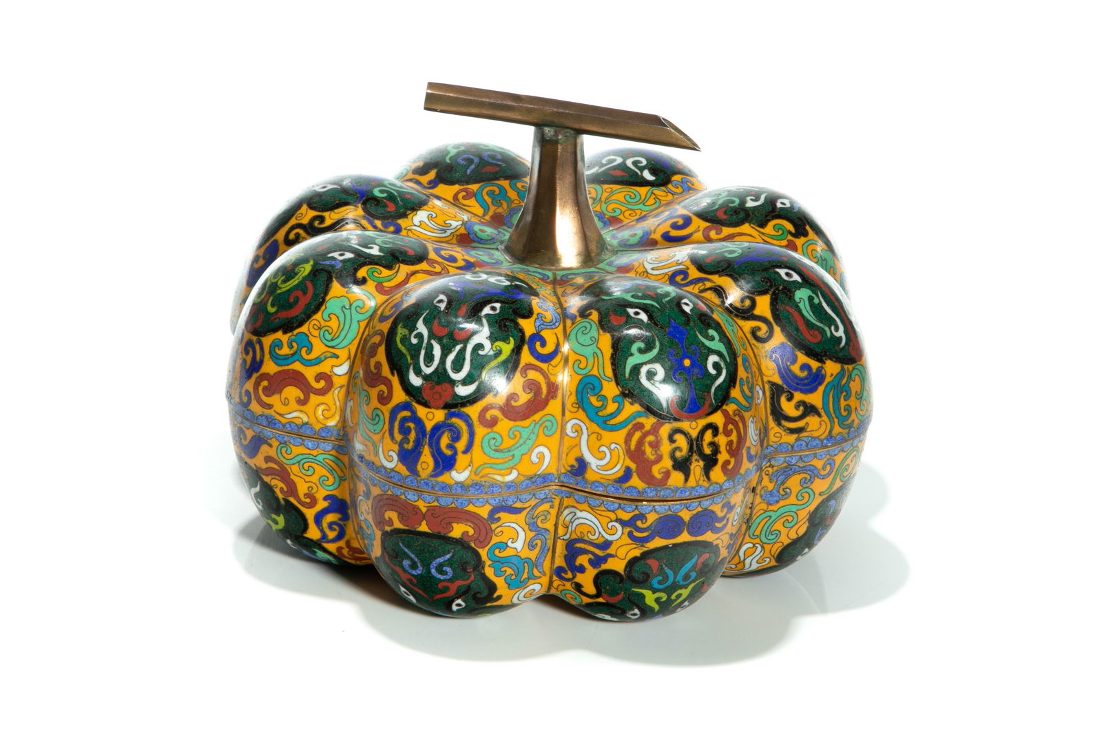 CHINESE YELLOW CLOISONNE PUMPKIN BOX: Chinese, 20th century, with yellow ground on pumpkin-shaped box, having green dragon faces on each lobe of base and cover, with blue interior. Overall H. 17.2cm (6 3/4in) Diameter 24.5cm (91/2in)