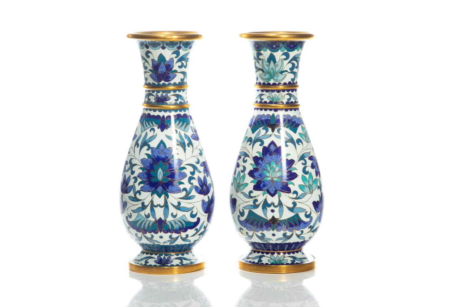PAIR OF CHINESE WHITE & BLUE CLOISONNE VASES: Chinese, 20th century, the pair of vases having white enamel ground, and with blue lotus and bats on body, with double brass ring on neck and slightly flaring mouth rims. Turquoise blue enameled bases