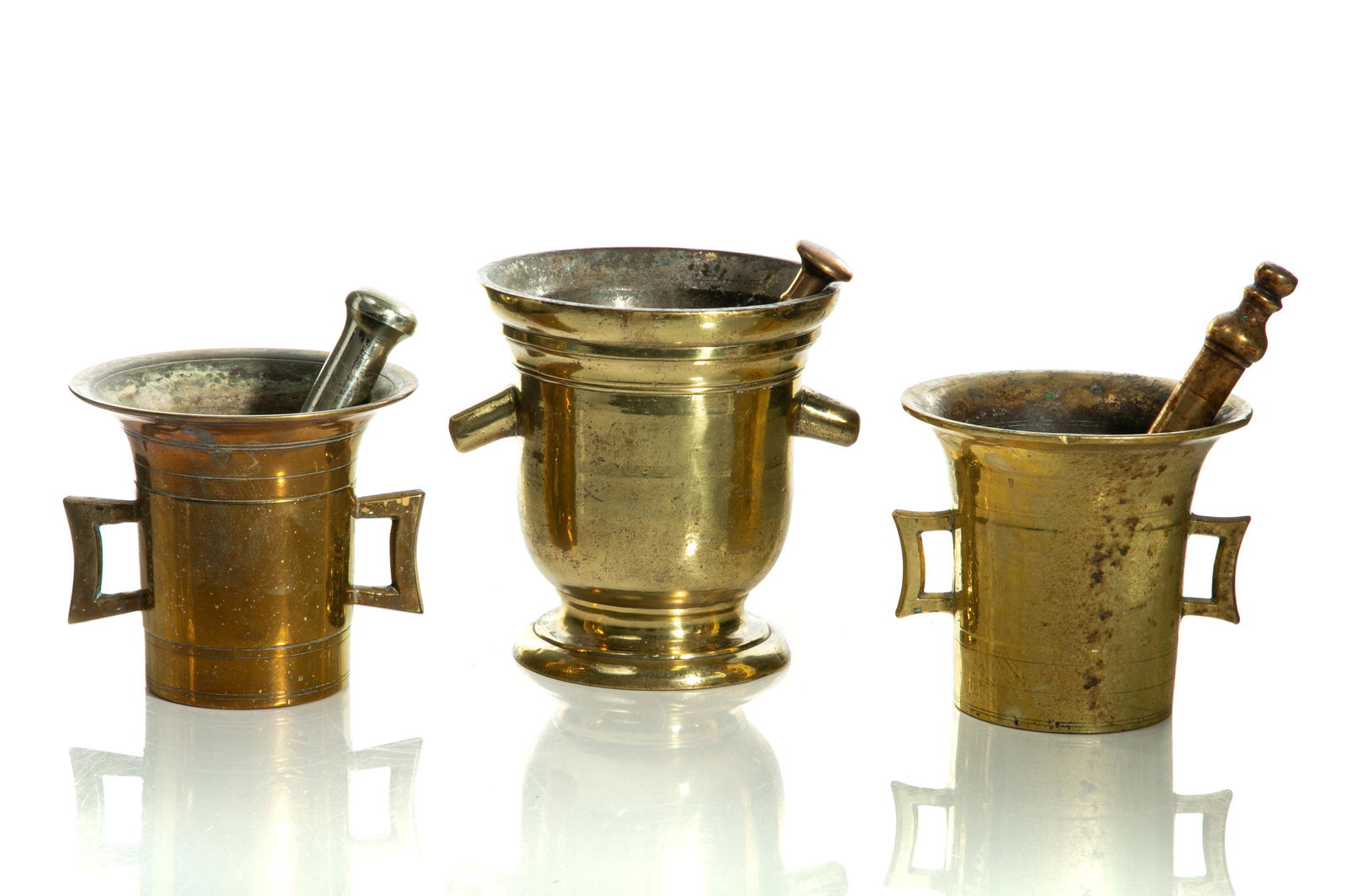 THREE ANTIQUE BRASS MORTARS & PESTLES (1 of 2)