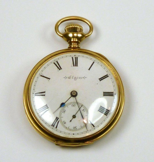 ELGIN 18K GOLD POCKET WATCH STORK & CO RANGOON: With engine turned case and white enamel dial with roman numerals. Retailer Stork & Co. Rangoon. Working. Diamter of case 4.7 cm.