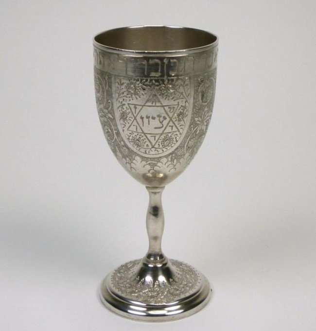 PERSIAN SILVER KIDDUSH CUP: Of goblet form with Hebrew inscription around the top rim. Iranian, mid 20th century. H 15.6 cm, 194 grams.