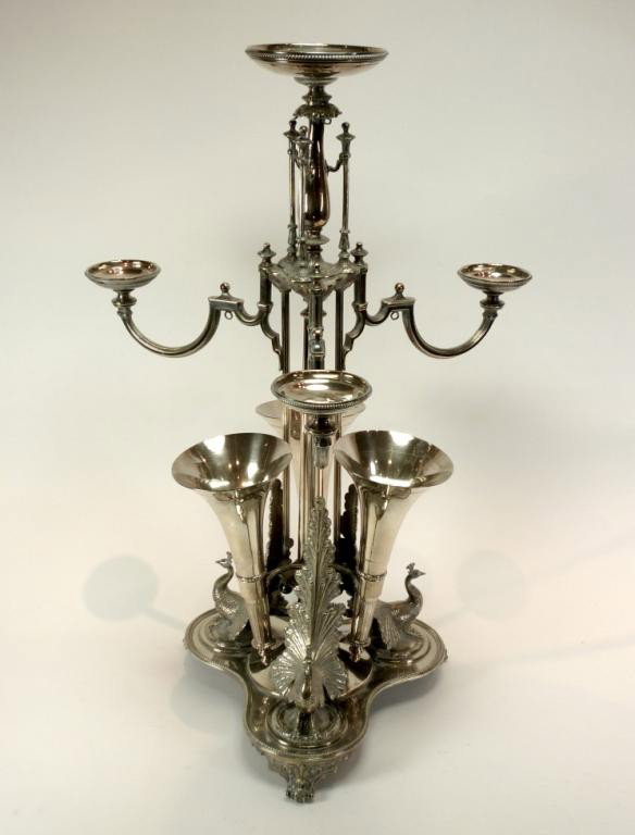 ENGLISH VICTORIAN SILVERPLATE CENTERPIECE EPERGNE: With three removable fluted vases and three arms supporting pads for bowls. The base with three figures of peacocks. Unmarked, English registration diamond. H 58.5 cm ( 23").