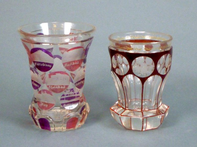 TWO 19TH CENTURY BOHEMIAN GLASS BEAKERS: The first flashed and etched spa roundels. The second with red flashing and etched roundels of traits and religion. Both in the manner of Egermann. H of first 11.5 cm. (4 1/2 in.)