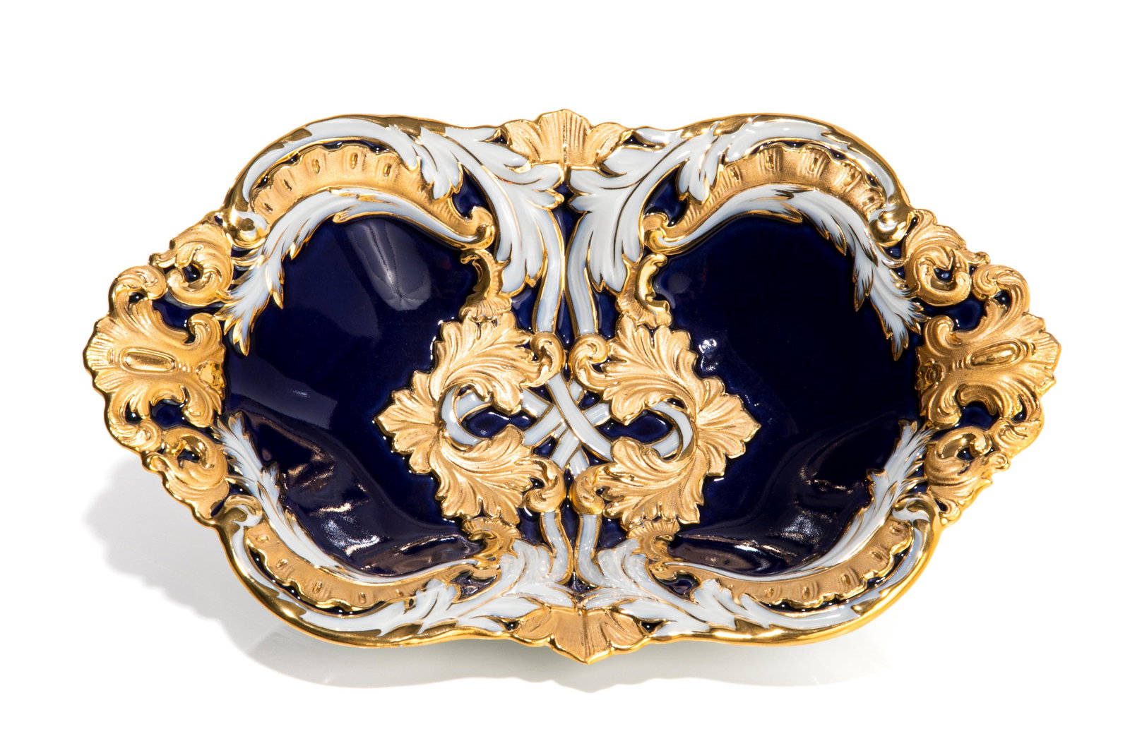 MEISSEN COBALT & GILT PORCELAIN BOWL: A Meissen porcelain and enameled bowl, with dark blue enameling and rococo style gilding. Crossed swords to base, second grade. 20th C. H. 31cm (12in)