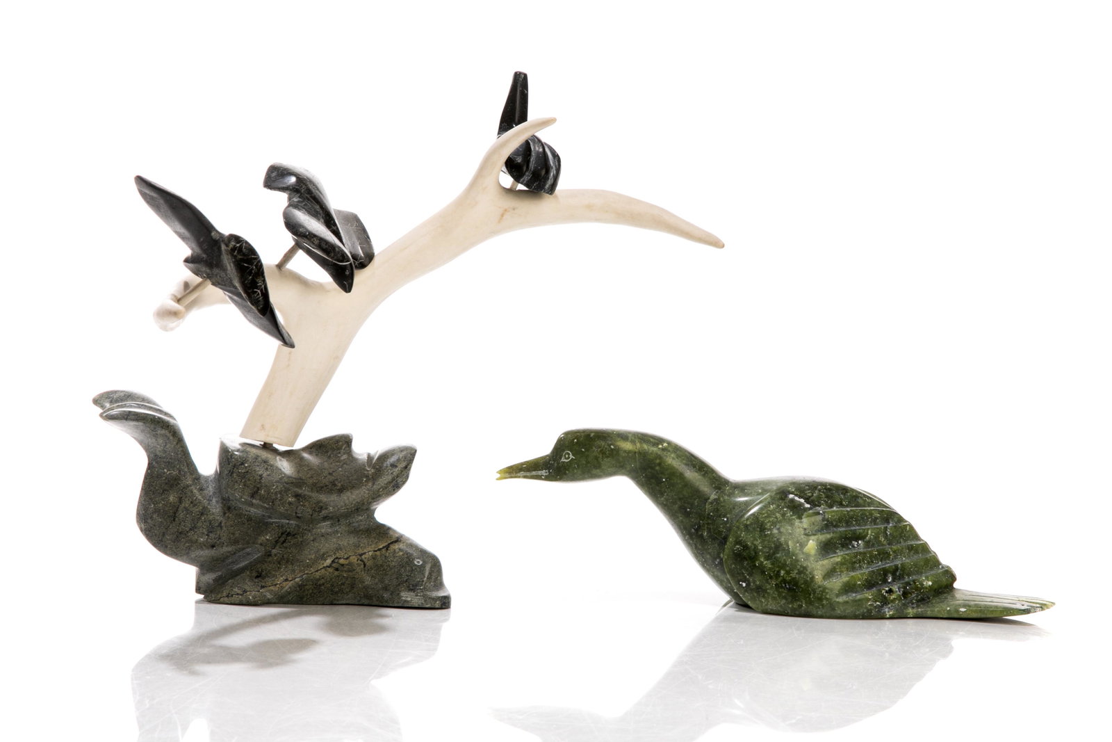 TWO INUIT CARVED SOAPSTONE FIGURES: One figural group of birds on an antler mounted onto a carved whale base, signed to underside with initials. Handmade by Canadian Inuk artist, Jamasie (Jessie / Jaco) Ishulutaq (Pangnirtung). 26-17613