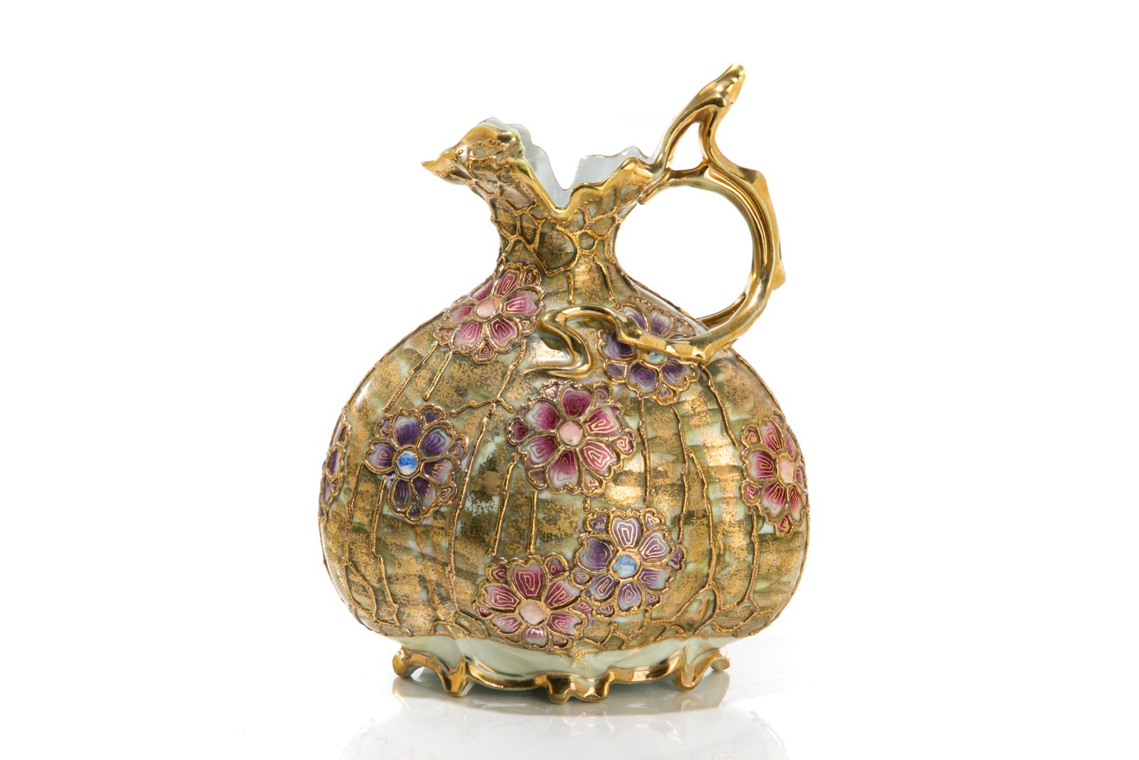 NIPPON SECESSIONIST INFLUENCED PORCELAIN EWER: Art Nouveau flat bulbous body with exaggerated handle. Tiffany jewelling and colours, with raised gilded enamel piping in a pink and purple floral pattern. Japanese, blue maple leaf mark, earlyNoritak