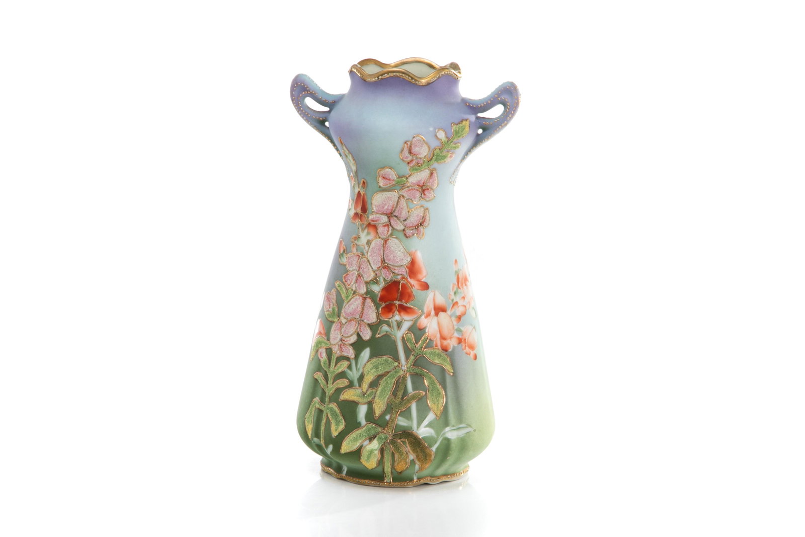 NIPPON TWO HANDLED CORALENE PORCELAIN VASE: Art Nouveau form vase with red and pink blossom flowers on a purple to green mottled ground with gilt jewelled handles. Japanese, US patent 1909 mark. H. 23 cm (9 in.)