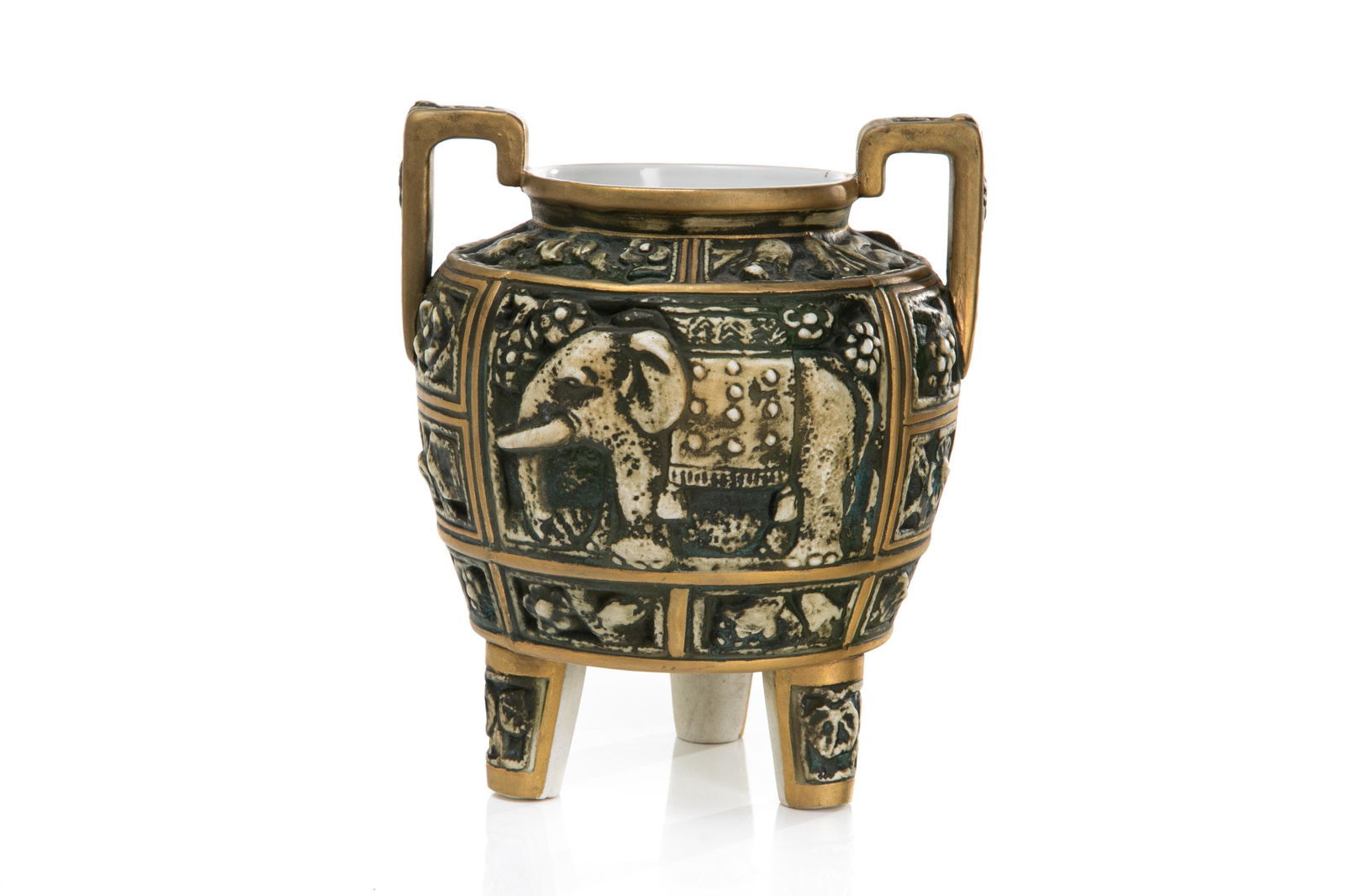 NIPPON ELEPHANT RELIEF MOLDED PORCELAIN VASE: Molded in relief panels of flowers and birds surrounding the largest panel of an elephant. Body raised on rounded tripod feet with two handles. Japanese, green M in wreath mark, early Noritake. H. 18.
