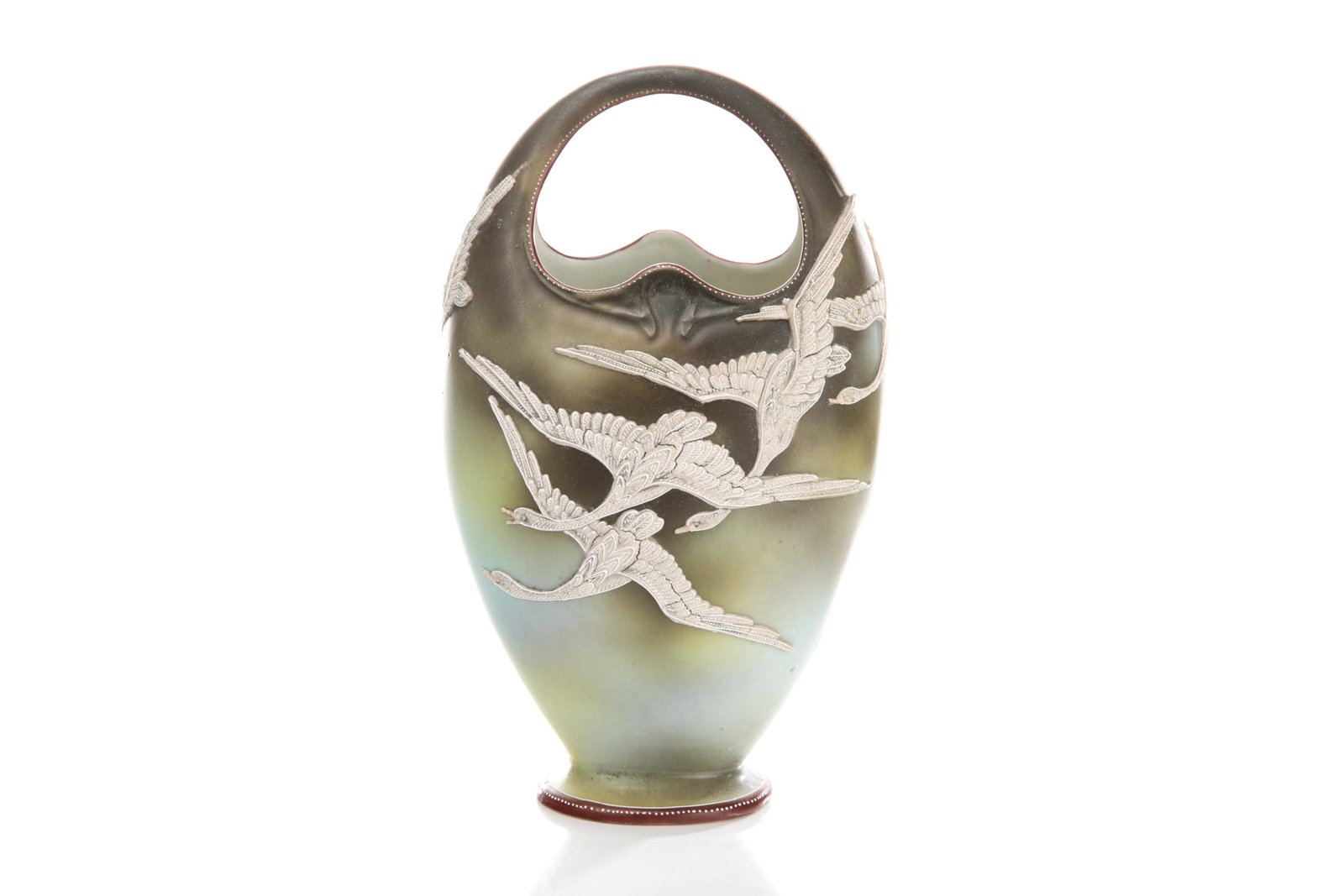 NIPPON SWAN MORIAGE PORCELAIN BASKET VASE: Gradual grey matte glazed ground with moriage flying swans. Japanese, green Nippon maple leaf mark. H. 21 cm (8 1/4 in.)