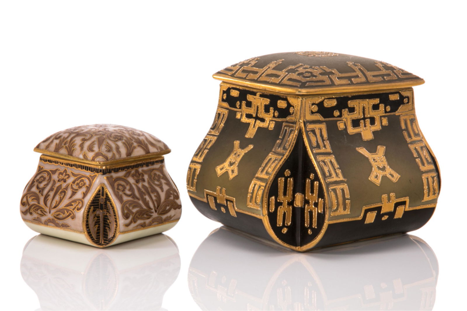 TWO NIPPON PORCELAIN COVERED DRESSER JARS: Two toned brown glaze with geometric piped gilded pattern, cushion top squared body. Japanese, blue M in wreath mark, early Noritake. Together with a smaller jar two tone jar withfloral piped gilded p