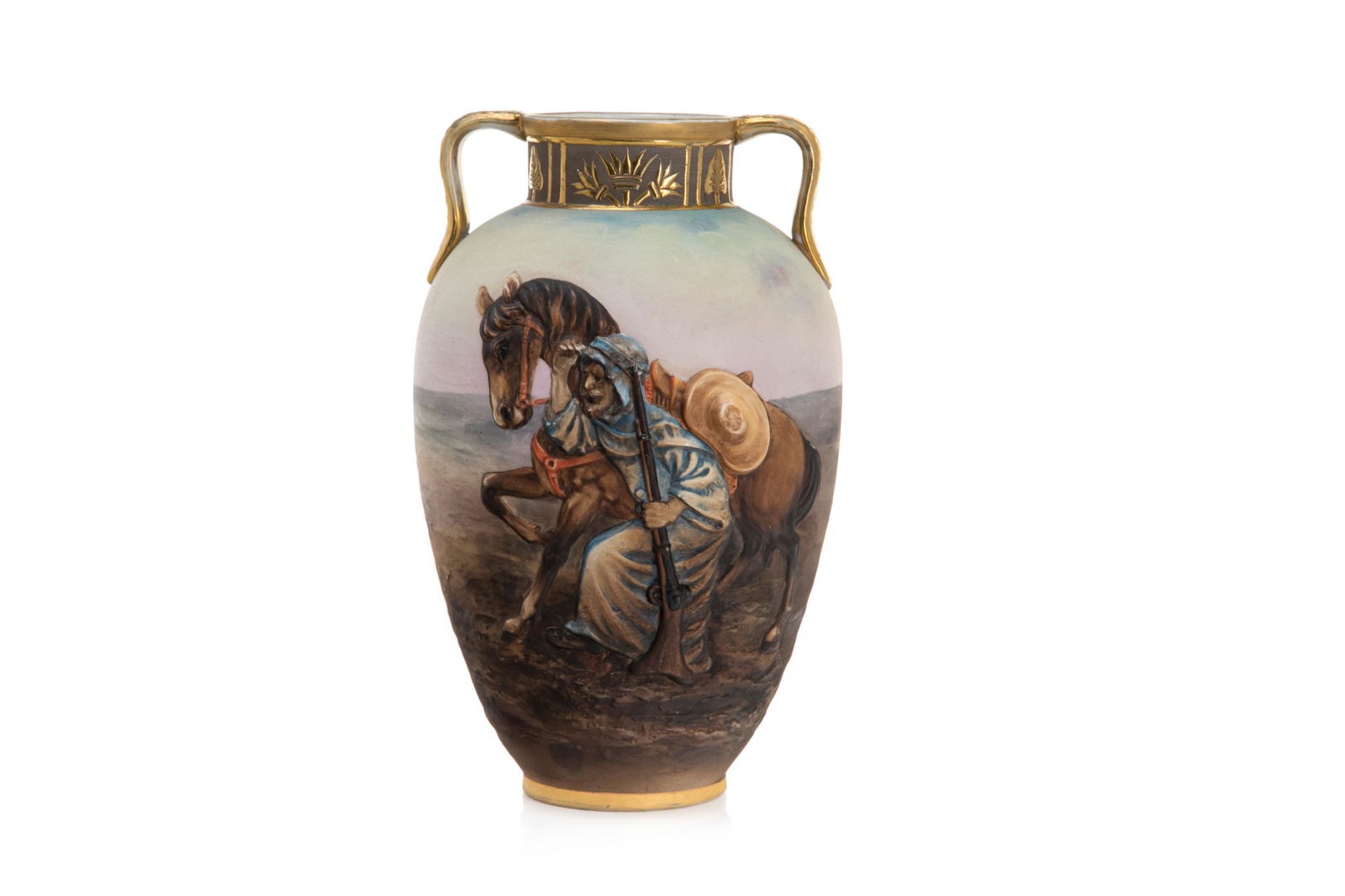 NIPPON MOLDED IN RELIEF FIGURAL PORCELAIN VASE: The Bedouin Retraining a Horse pattern with desert scene on the reverse. Orientalist inspired border accented with gilt handles. Japanese, green M in wreath mark, early Noritake. H. 24 cm (9 1/2 in.)
