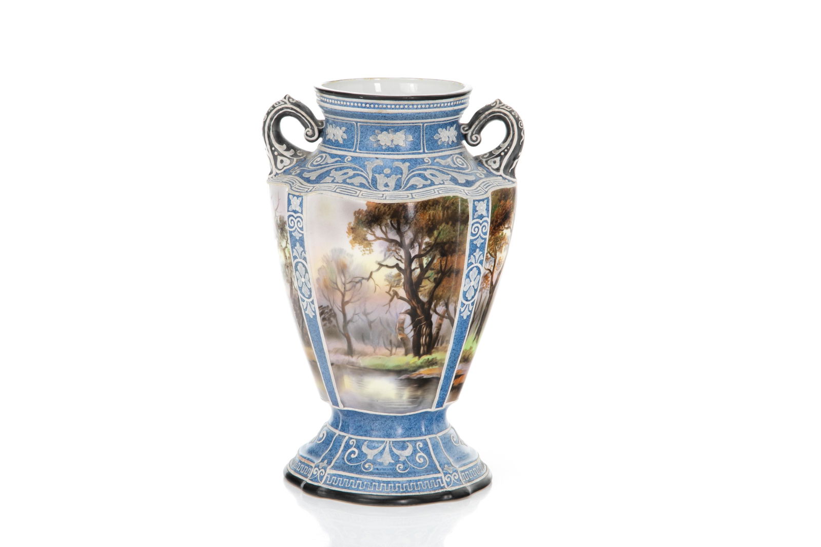 NORITAKE JASPERWARE STYLE PORCELAIN VASE: Two-handled porcelain vase with speckled blue ground and white slip decoration in the manner of Wedgwood Jasperware. Hand painted landscape panels on the body. Japanese, green M in wreath mark tobase.