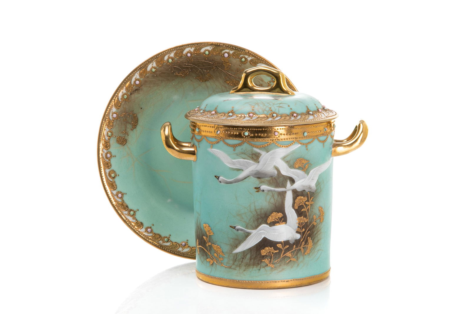 NIPPON FLYING SWAN PORCELAIN CONDENSED MILK SET: Flying Swan pattern, set in turquoise with painted swans and foliage, jewelled enhanced gilded borders. Japanese, green M in wreath mark, early Noritake. Overall H. 15 cm (6 in.)