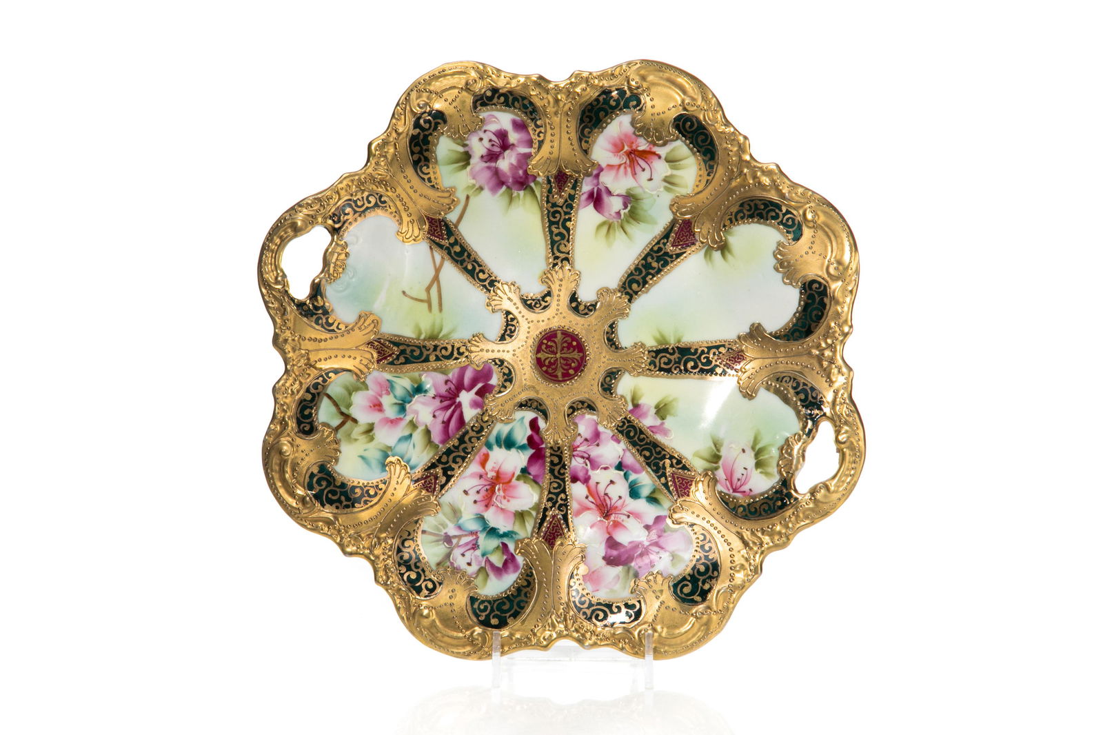 NIPPON TWO HANDLED PORCELAIN CAKE PLATE: A hand-painted, richly gilded cake plate with twin handles and pink flowers. Japanese, green maple leaf mark, early Noritake. Dia. 28 cm (11 in.)
