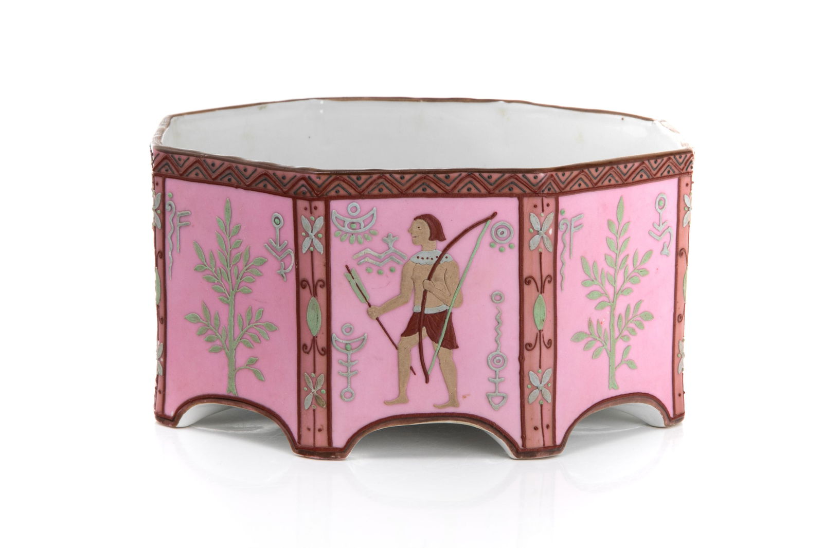 NIPPON OCTAGONAL PORCELAIN JARDENIERE: Pink glazed body with raised enamel geometric border flanking panels of Egyptian figures and hieroglyphs. Japanese, green M in wreath mark, early Noritake. Dia. 17.5 cm (6 3/4 in.)