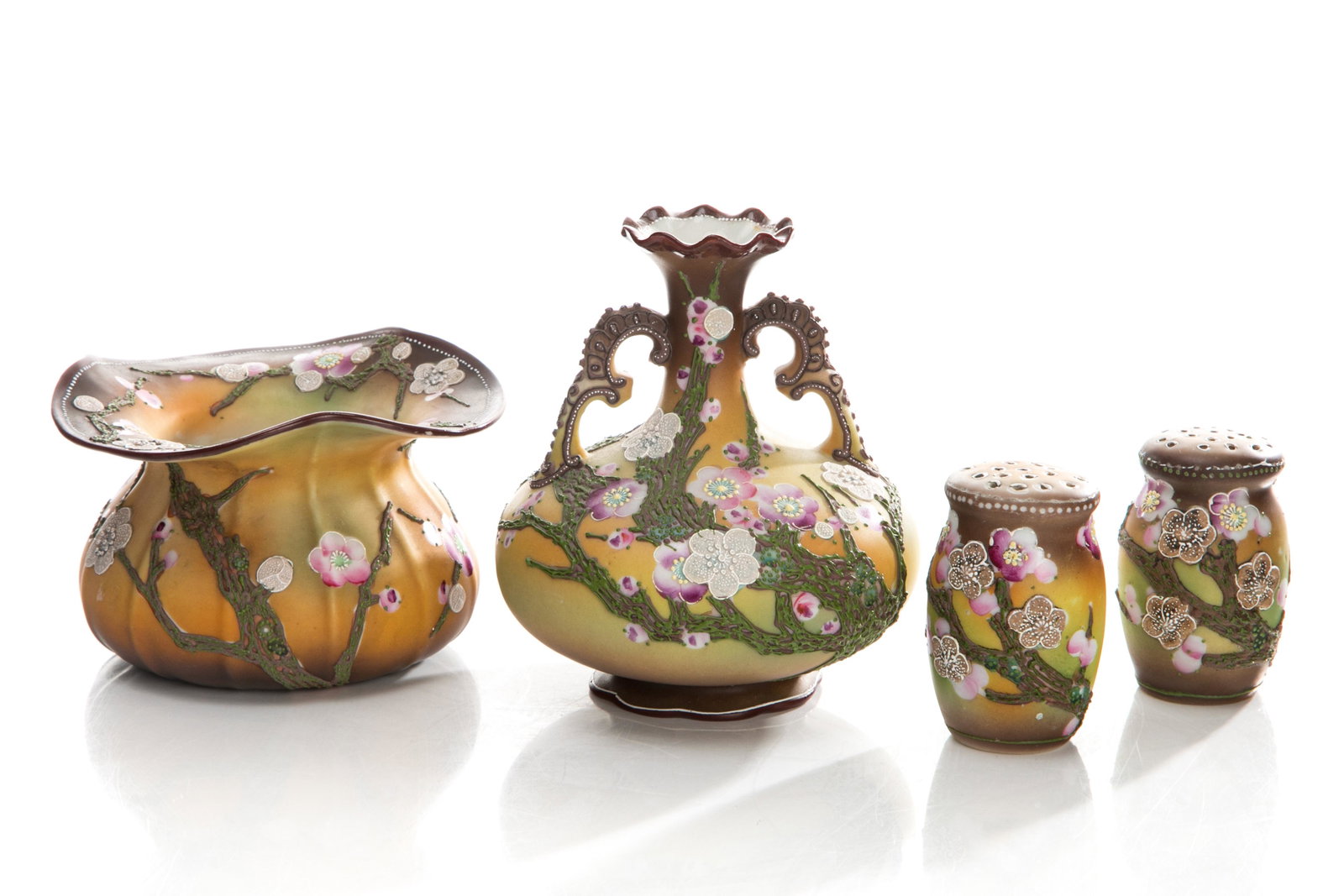 FOUR NIPPON MORIAGE CHERRY BLOSSOM PIECES: Includes a small scalloped rim oval vase, a two handled vase with bulbous form, salt and pepper shakers, all in matte glaze. Japanese, green maple leaf Nippon mark. H. of tallest: 13.5 cm (5 1/4 in.)