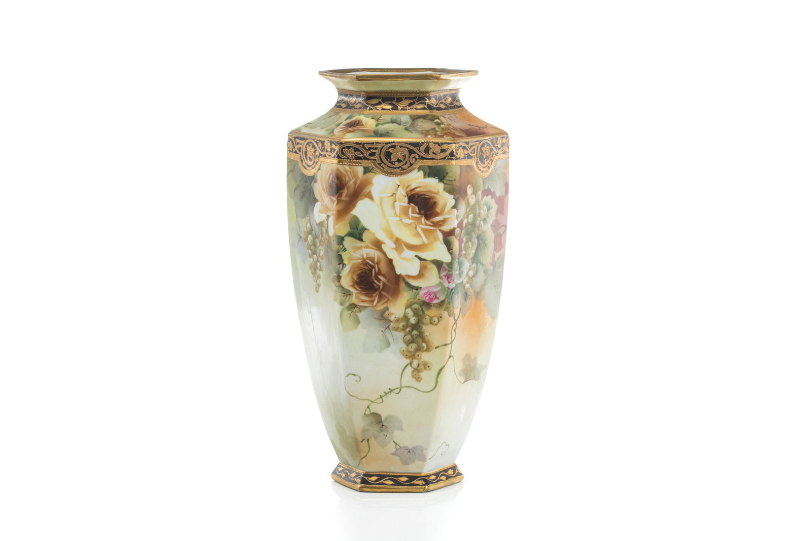 LARGE NIPPON PORCELAIN VASE: Gradual yellow matte glazed ground with hand painted yellow roses and grapes, gilded decoration. Japanese, green maple leaf mark, early Noritake. H. 37 cm (14 1/2 in.)