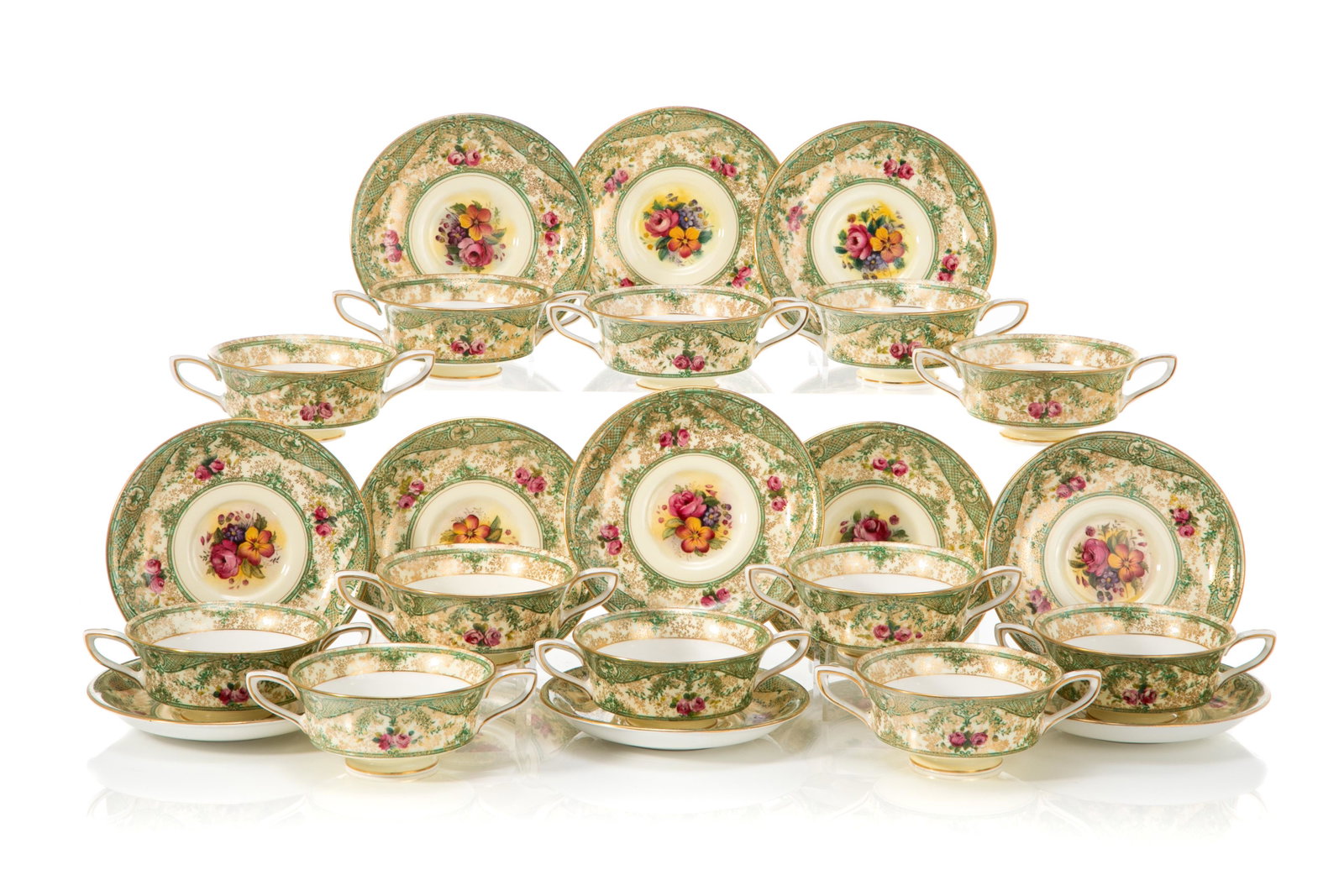 TWELVE ROYAL WORCESTER SOUP BOWLS: A set of twelve Royal Worcester soup bowls and underplates, with hand painted rose spray and green and gilded foliate motif on a cream ground. Royal Worcester marks to underside for 1930,pattern numbe