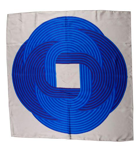 HERMES J. STEIN SILK SCARF: Maillions de Joel Stein silk Hermes scarf with central stylize blue medallion pattern, produced in collaboration with French artist Joel Stein. Signed Hermes to scarf and tag, 100% silk, 2013. W. 90cm