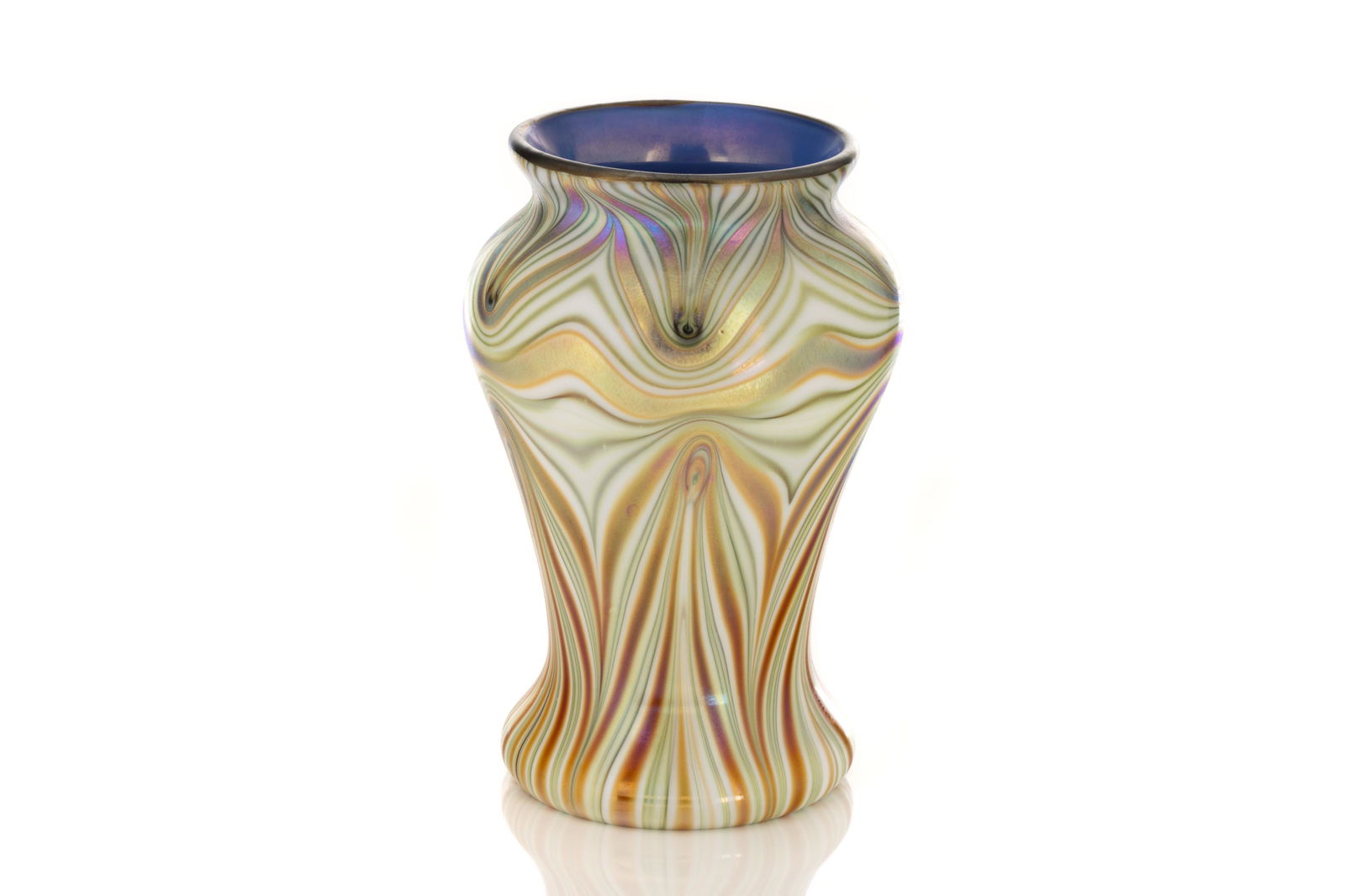 ORIENT & FLUME IRIDESCENT PULLED GLASS VASE: With pulled feathering decoration of combined lime green and burnt orange, highlighted with iridescent touches. Blue glass finish to interior, signed Orient & Flume, pattern 740124 to base.American, 2