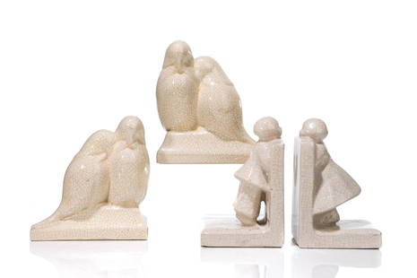 TWO PAIRS OF FRENCH POTTERY BOOKENDS: A pair of art deco cream coloured crackle glaze bird form bookends signed Louis Fontinelle France, together with a similar pair of stoneware crackle glaze bookends, with young girl in dress peeringove