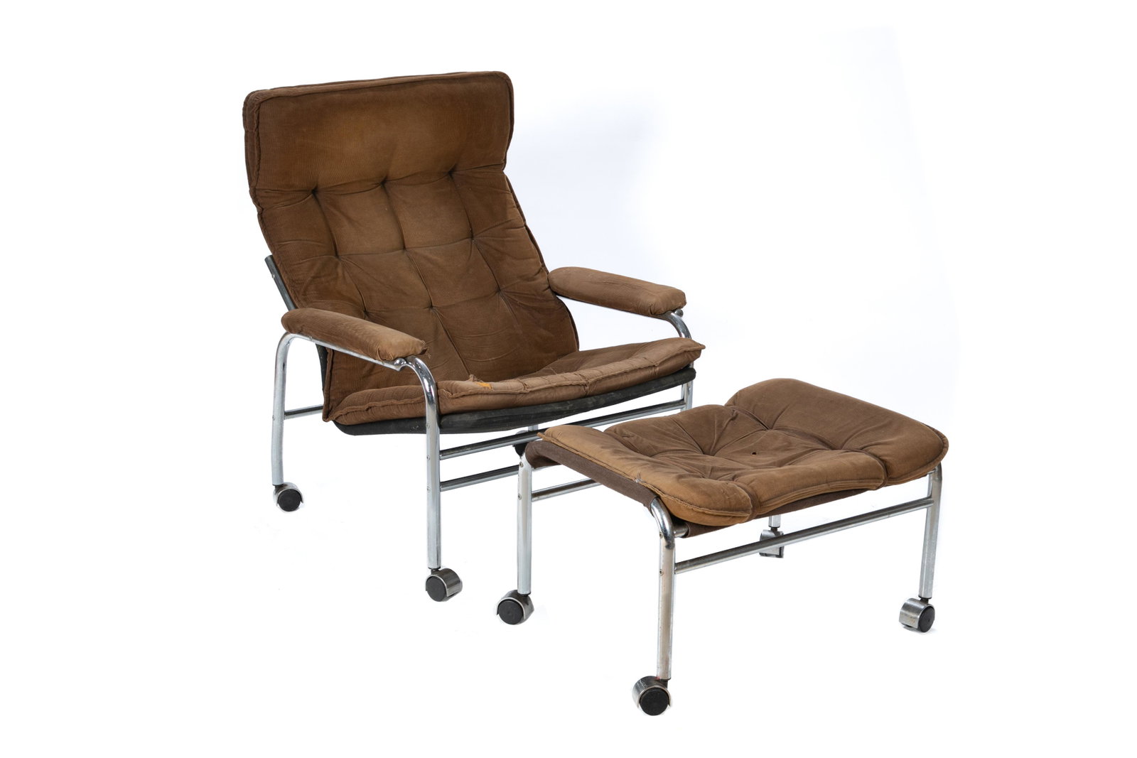 MCM LOUNGE CHAIR & OTTOMAN: Reclining chair with brown corduroy upholstery on polished steel frame. With matching ottoman. Some condition to the upholstery.