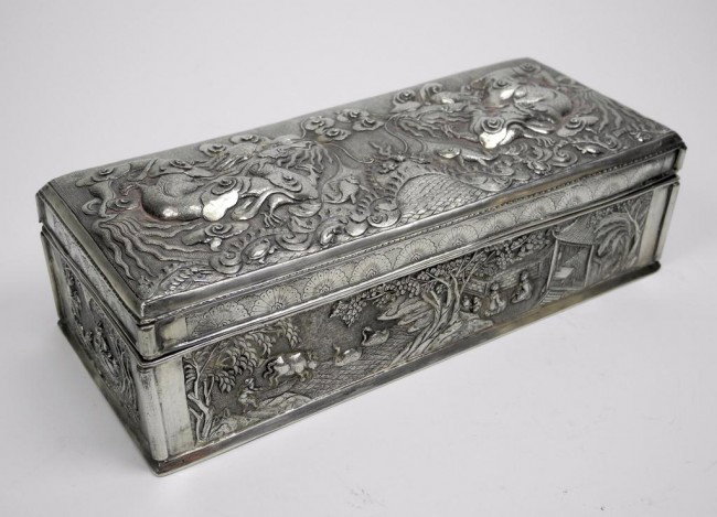LATE 19TH CENTURY CHINESE EXPORT SILVER BOX: With embossed and repousse decoration of dragons and landscape scenes. Maker's mark Chengdu Li Sheng, Wen Yin. W 22.5 cm. (8 7/8 in.), 478 g.