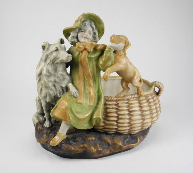 RSK AMPHORA TURN TEPLITZ JARDENIER, 1903-1918: With a seated girl between two dogs next to a large basket. Model number 20004. W 23 cm. (9 in.)