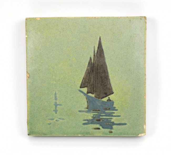 AMERICAN ARTS CRAFTS POTTERY TILE MARBLEHEAD: Painted in a soft green tone with a sailboat in blue and black. Impressed mark. W 15.5 cm (6 1/8")