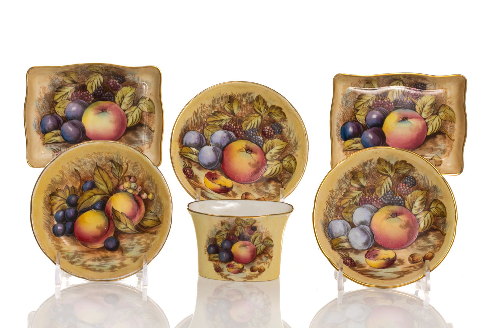 SIX AYNSLEY PORCELAIN SMALL DISHES: A set of five Aynsley nut dishes, three circular and two square, paired with a toothpick holder. Of hand painted bone china with gilding and scalloped edge, pattern number 1325. Signed D.Jones, with m