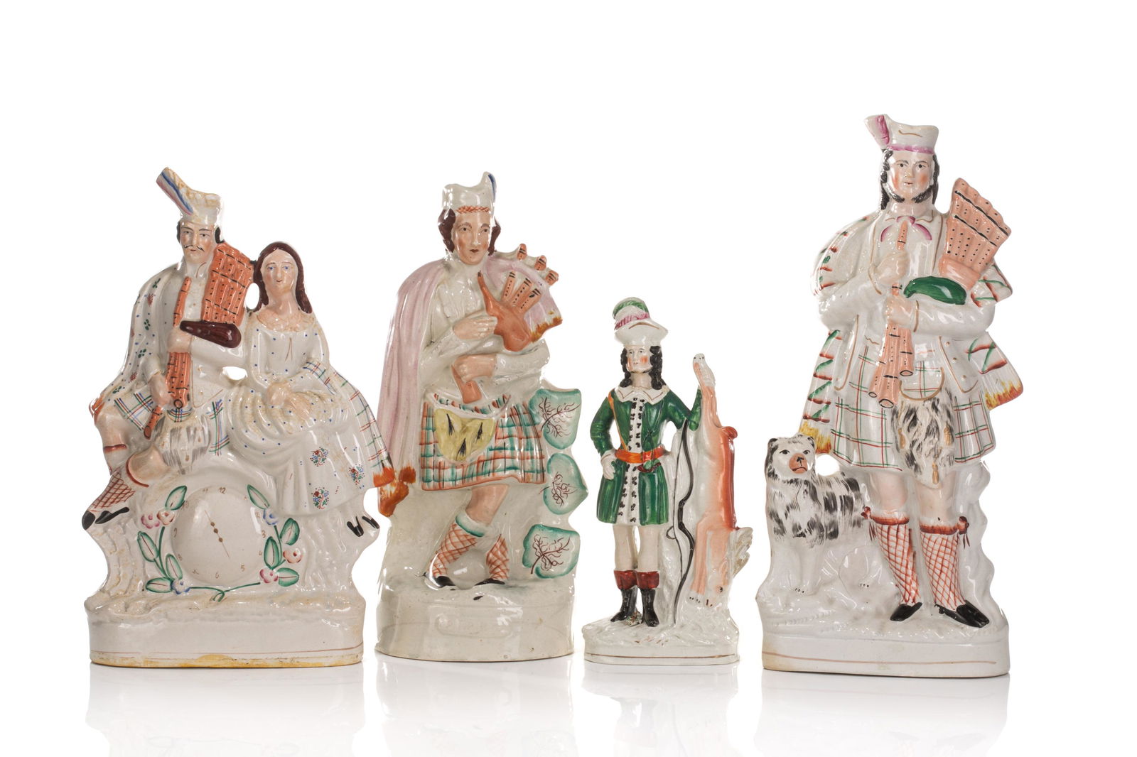 FOUR LARGE STAFFORDSHIRE POTTERY FIGURES (1 of 2)