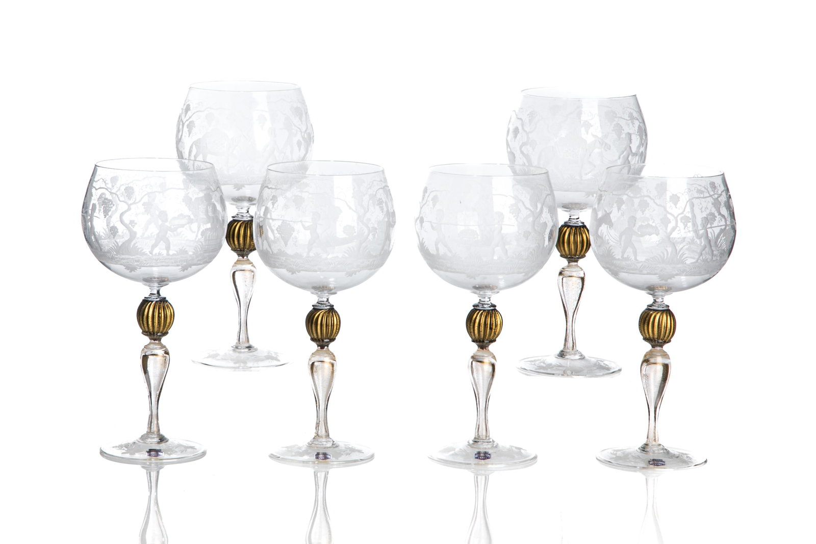 SIX CENEDESE BURGUNDY WINE GLASSES: Etched to body with putti and scrollwork designed, ribbed knob stem of gold flecks on circular foot. Label for Cenedese, Venice, 20th C. H. 24cm (9 1/2in)