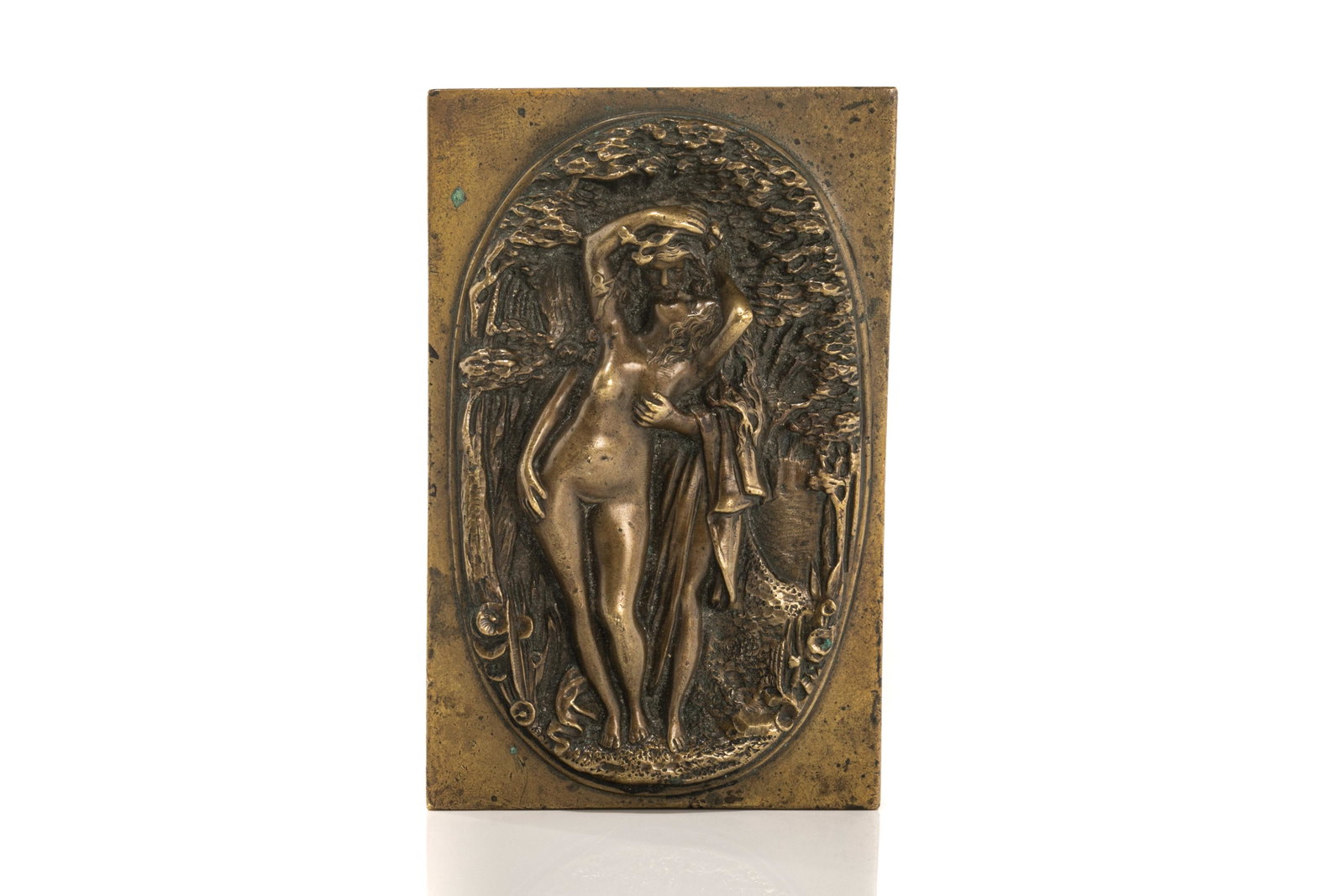 ART NOUVEAU BRONZE PLAQUE OF A NUDE: A woman in nature embracing a beaded man behind her. Unsigned. W. 11.1 cm (4 3/8 in.)