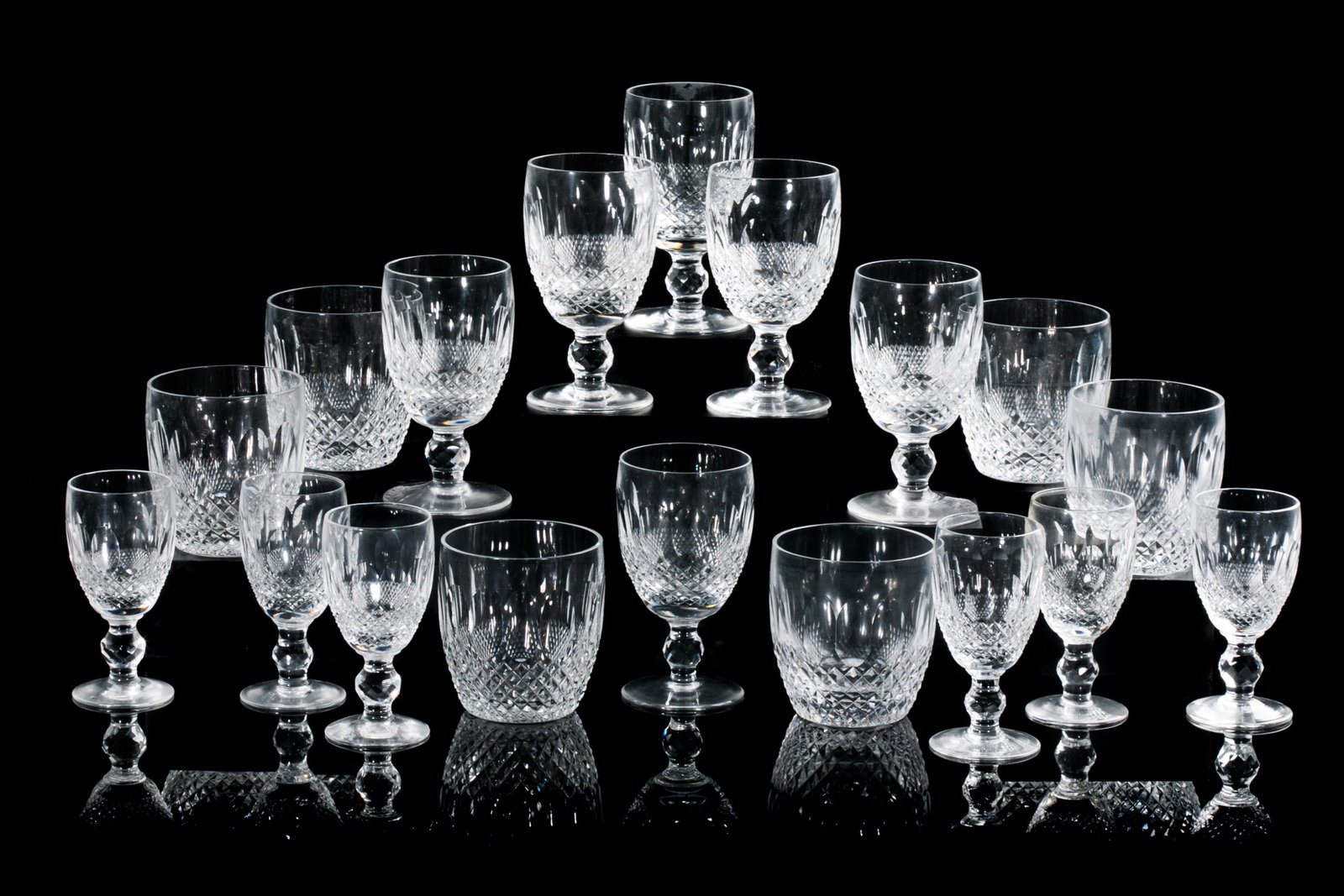 18 PCS WATERFORD COLLEEN GLASS STEMWARE: In the Colleen pattern, a grouping of 18 Waterford cut glasses, comprising six tumblers, six claret wine, and six sherry glasses. Cut glass, Waterford marks to base, 20th C. H. 12cm (4 3/4in)