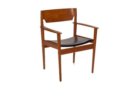 MCM DANISH TEAK ARMCHAIR: Teak frame with figured back and black leather seat. Made in Denmark by P. Jeppesen's Mobelfabrik, Store Heddinge. "George Tanier Selection" and "11" stamped underneath seat. H. 32 1/2" W. 25 1/2" D.