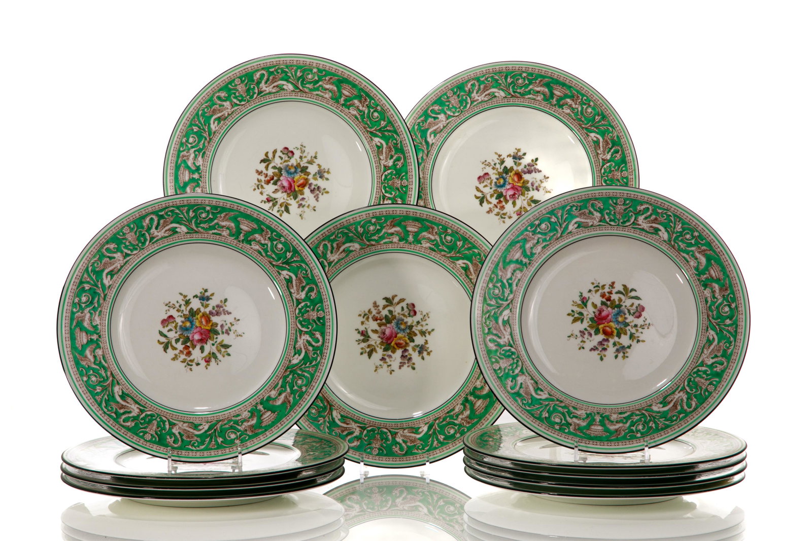 12 WEDGWOOD FLORENTINE PORCELAIN DINNER PLATES: Twelve dinner plates in the Florentine pattern, with scrollwork rim on green ground and central floral spray. Wedgwood marks to base, pattern no. W1222. 20th C. Dia. 26 .7cm (10 1/2in)