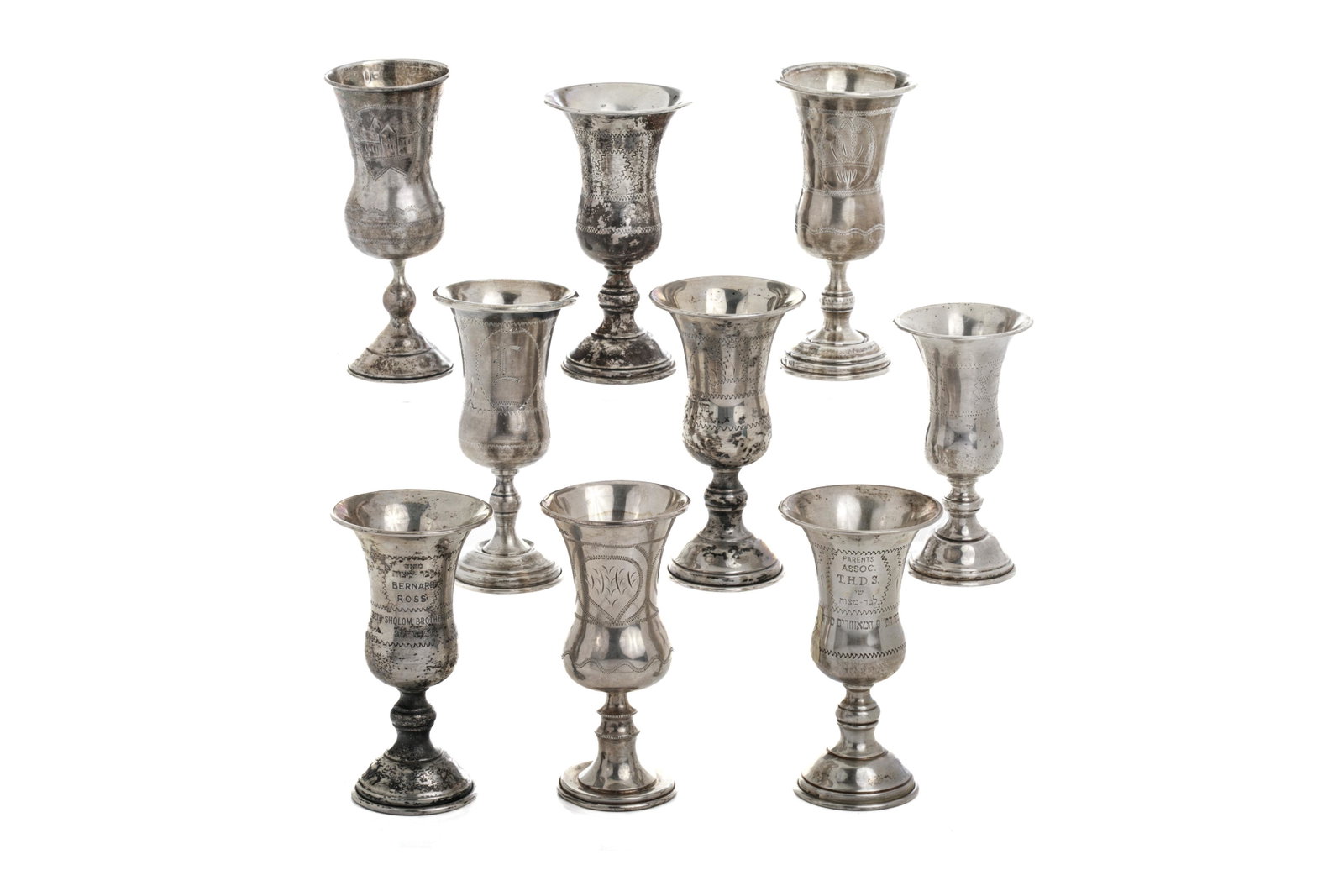 NINE JUDAICA SILVER SMALL KIDDUSH CUPS: .