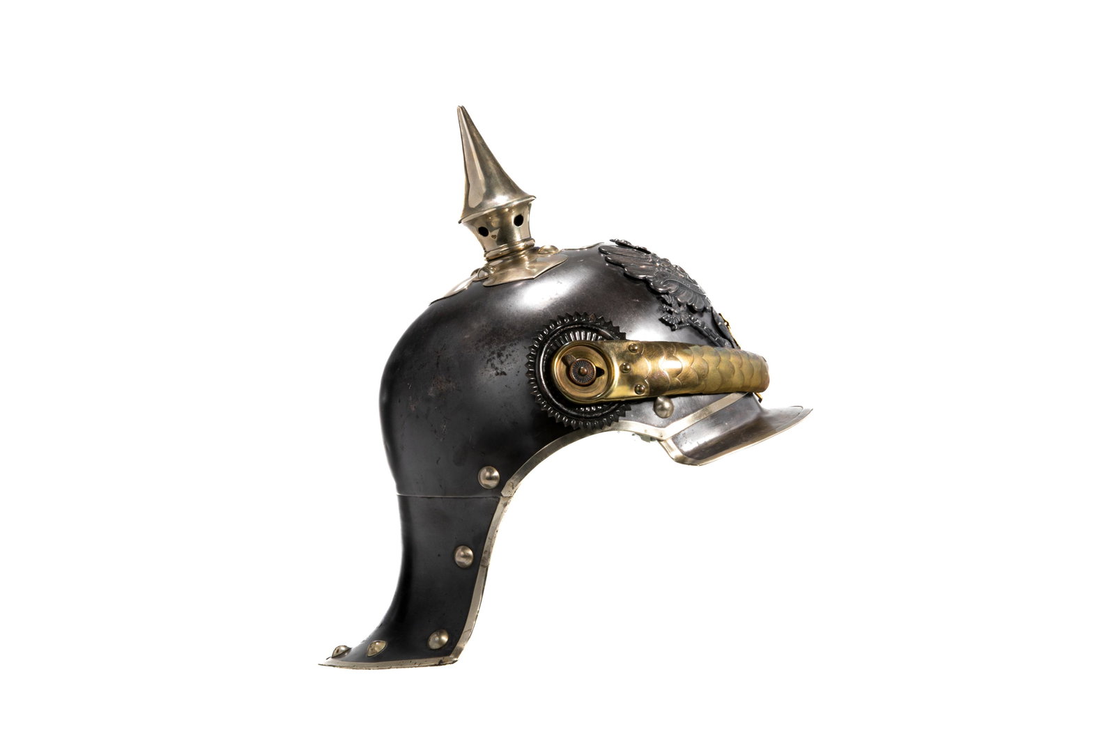 PRUSSIAN STEEL PICKLEHAUBE: An early 20th century Prussian steel Picklehaube with brass chin strap and additional brass Maltese cross. Marked to underneath J.Z. Pf. 6. Height 26 cm (10 1/4 in.) Provenance: The Collection of Yare