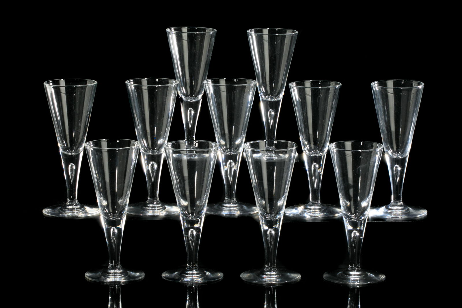 ELEVEN STEUBEN CLEAR WINE GLASSES: Trumpet form bowl with interior bubble to stem, on rounded base. Etched Steuben to base, pattern no. 7924.H. 5 1/2 in