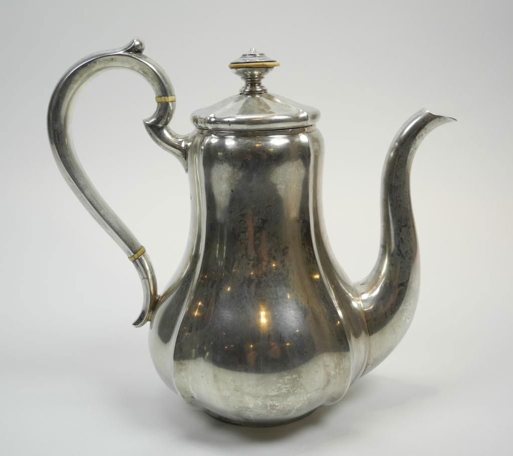 RUSSIAN IMPERIAL SILVER COFFEE POT: Moscow 1857 Maker Pavel Fedorovich Sazikov, Court Goldsmith. Marked to base with maker's mark, imperial warrant and assay master's mark. A fluted pear design with removable lid. Weight 768 gm. Height2