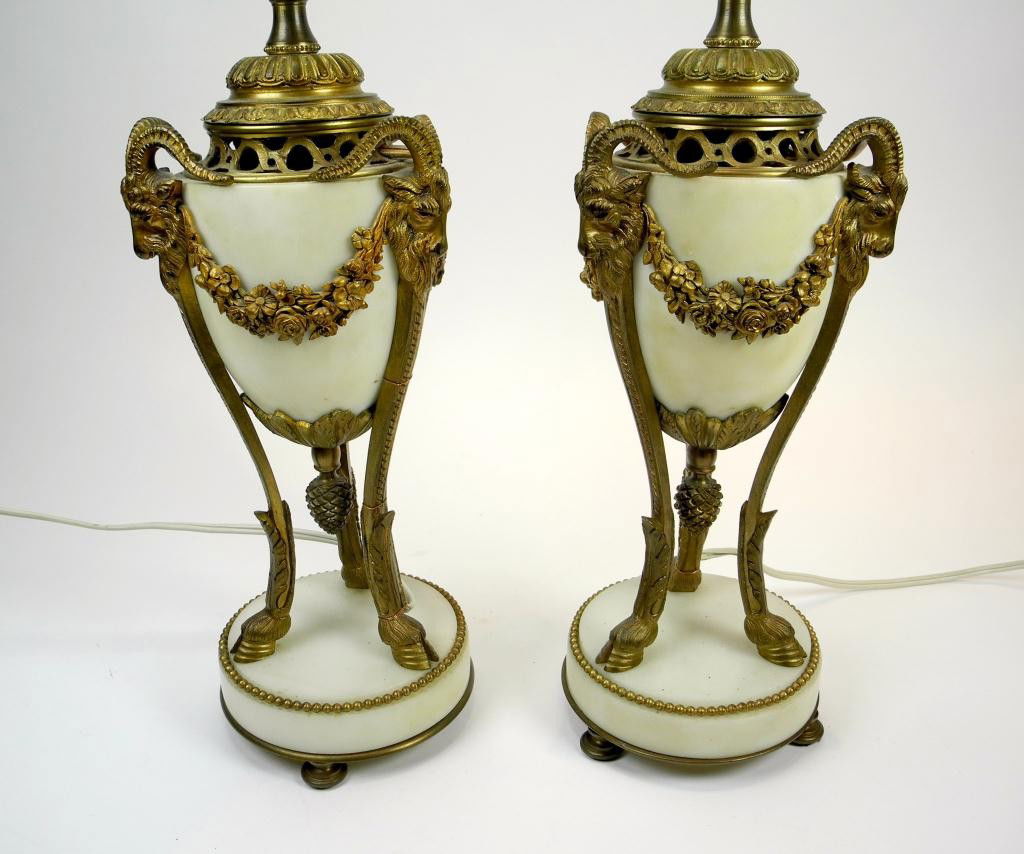 PAIR OF ALABASTER AND ORMOLU TABLE LAMPS: French Empire-style white marble urns with gilt bronze ram's head and swag mounts. H of body 30.5 cm. (12 in.)
