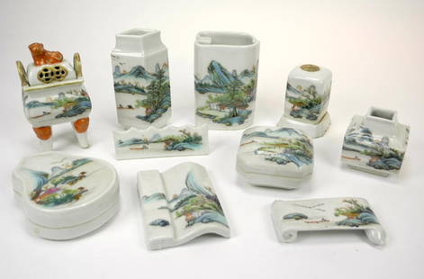 CHINESE FAMILLE ROSE PORCELAIN SCHOLAR DESK SET: Each piece hand painted with landscape and fisherman scenes, marked with four character Qianglong mark, late 19th/early 20th century. Comprising: 2 ink stick rests, brush rest, covered seal box, cover