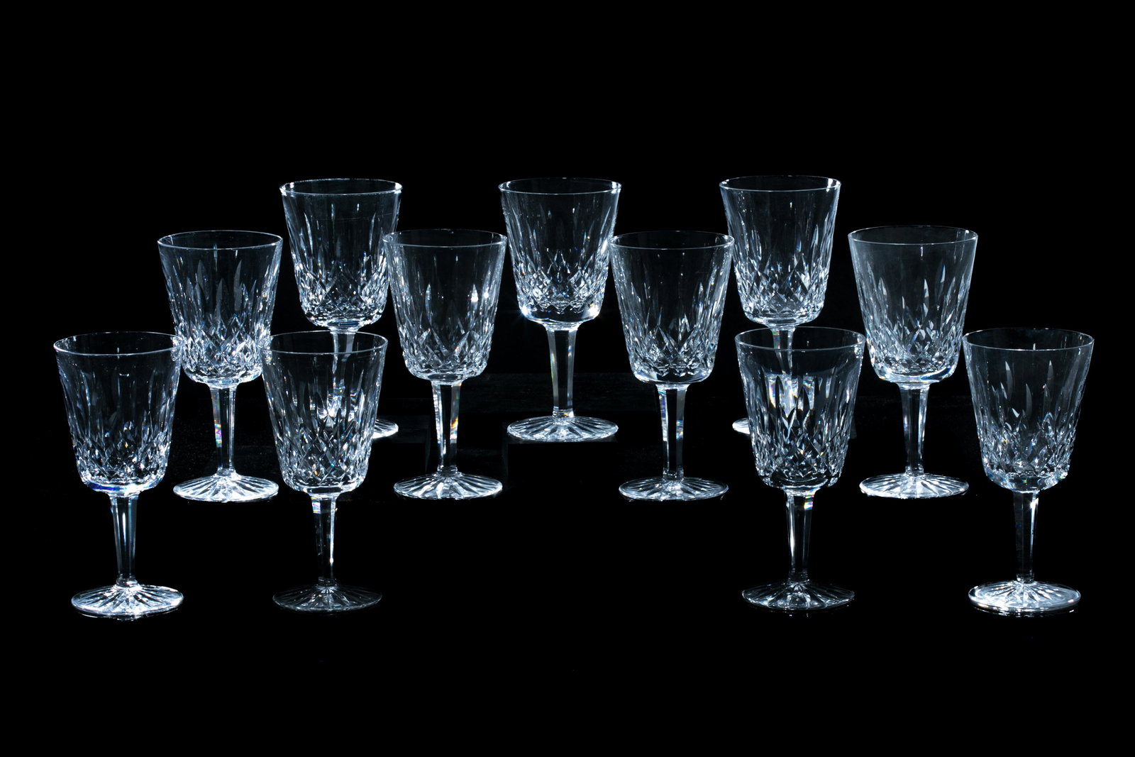 ELEVEN WATERFORD LISMORE WATER GOBLETS: In the Lismore pattern, etched Waterford to base, 20th C. H. 17.5cm (6 7/8in)