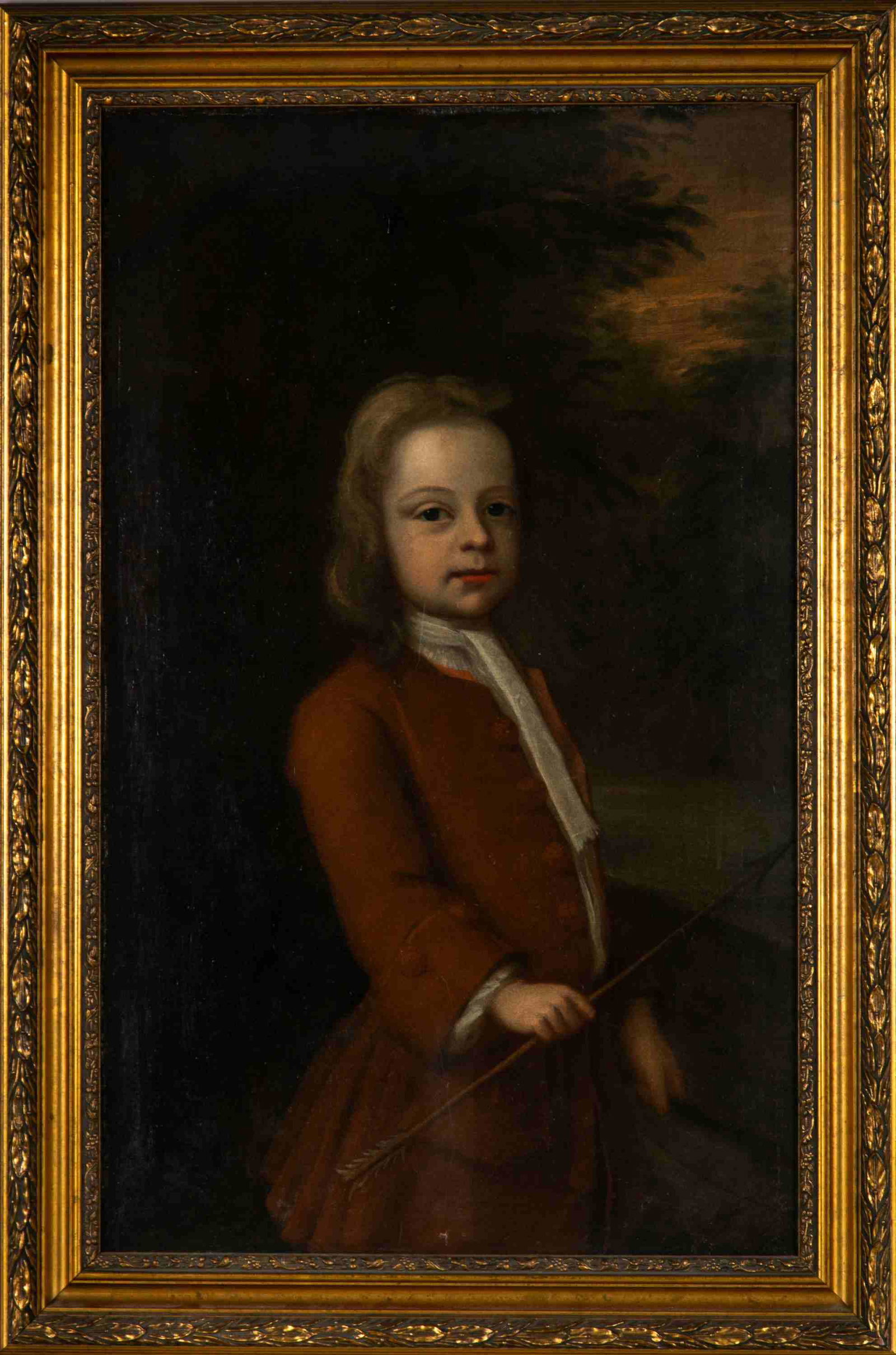 FOLLOWER OF JOHN S. COPLEY (American, 1737-1815): Portrait of a boy holding an arrow in three-quarter length Oil on canvas Size: 34.75 x 21.25 in.