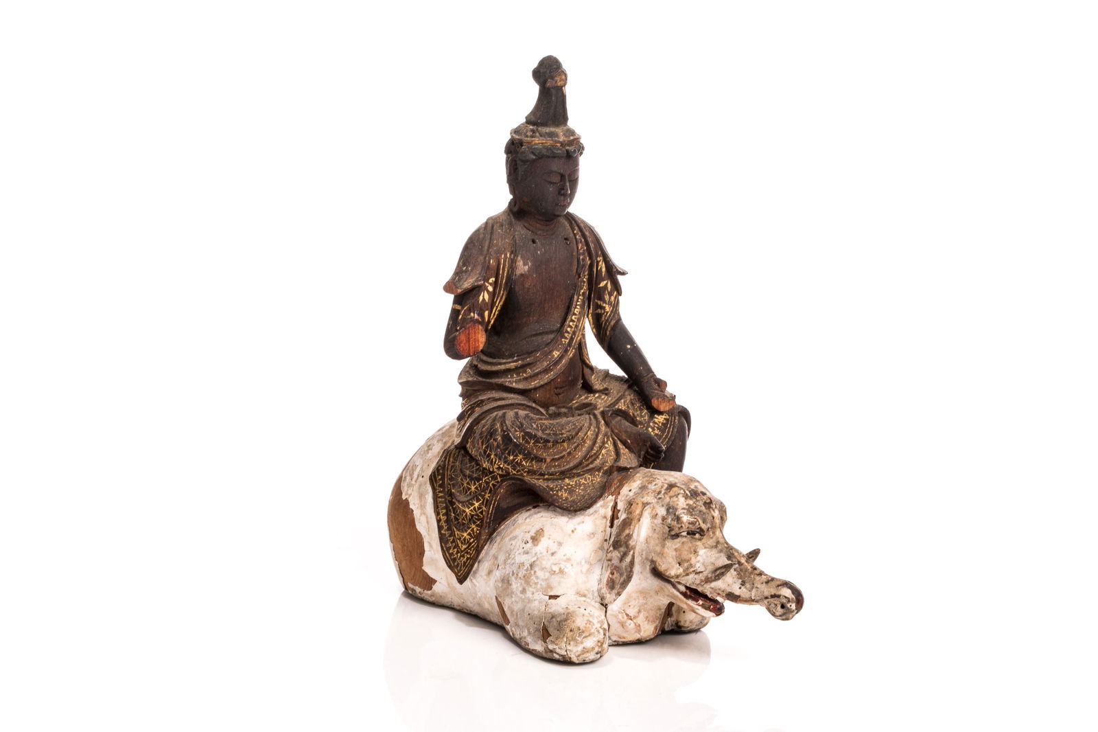 JAPANESE WOOD MONJU BOSATSU RIDING AN ELEPHANT: Japanese, 18th c. Wood-carved Monju Bosatsu riding on the back of an crouching white elephant. Exquisitely carved and painted and gilded with details. H. 12 cm (4 3/4 in.)
