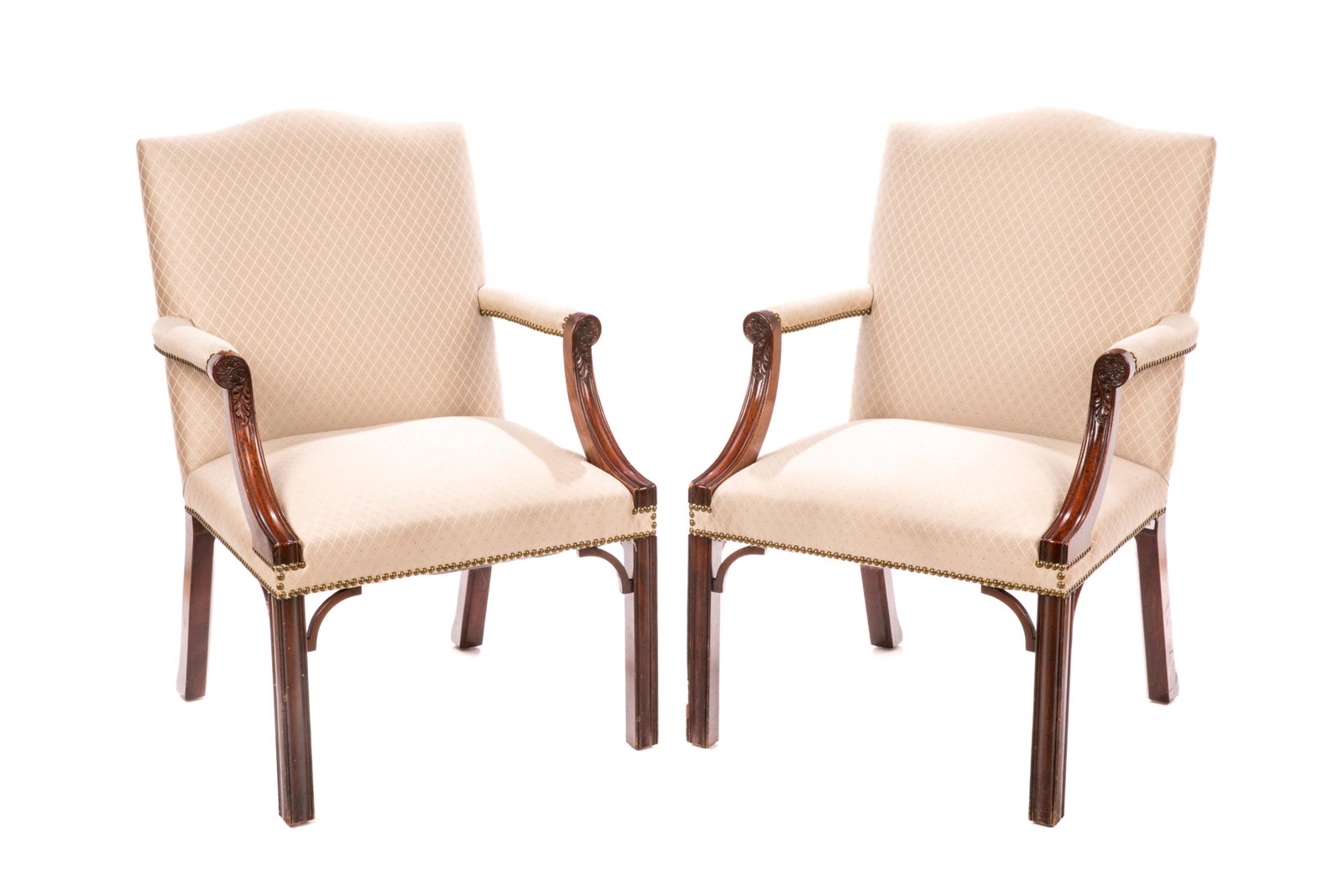 PAIR OF UPHOLSTERED GAINSBOROUGH STYLE ARMCHAIRS: Pair of open fauteuil armchairs with cream upholstery with lozenge design and studded detail. The arms with foliate carved motif, straight legs. H 39", W 26", D 25 1/2"
