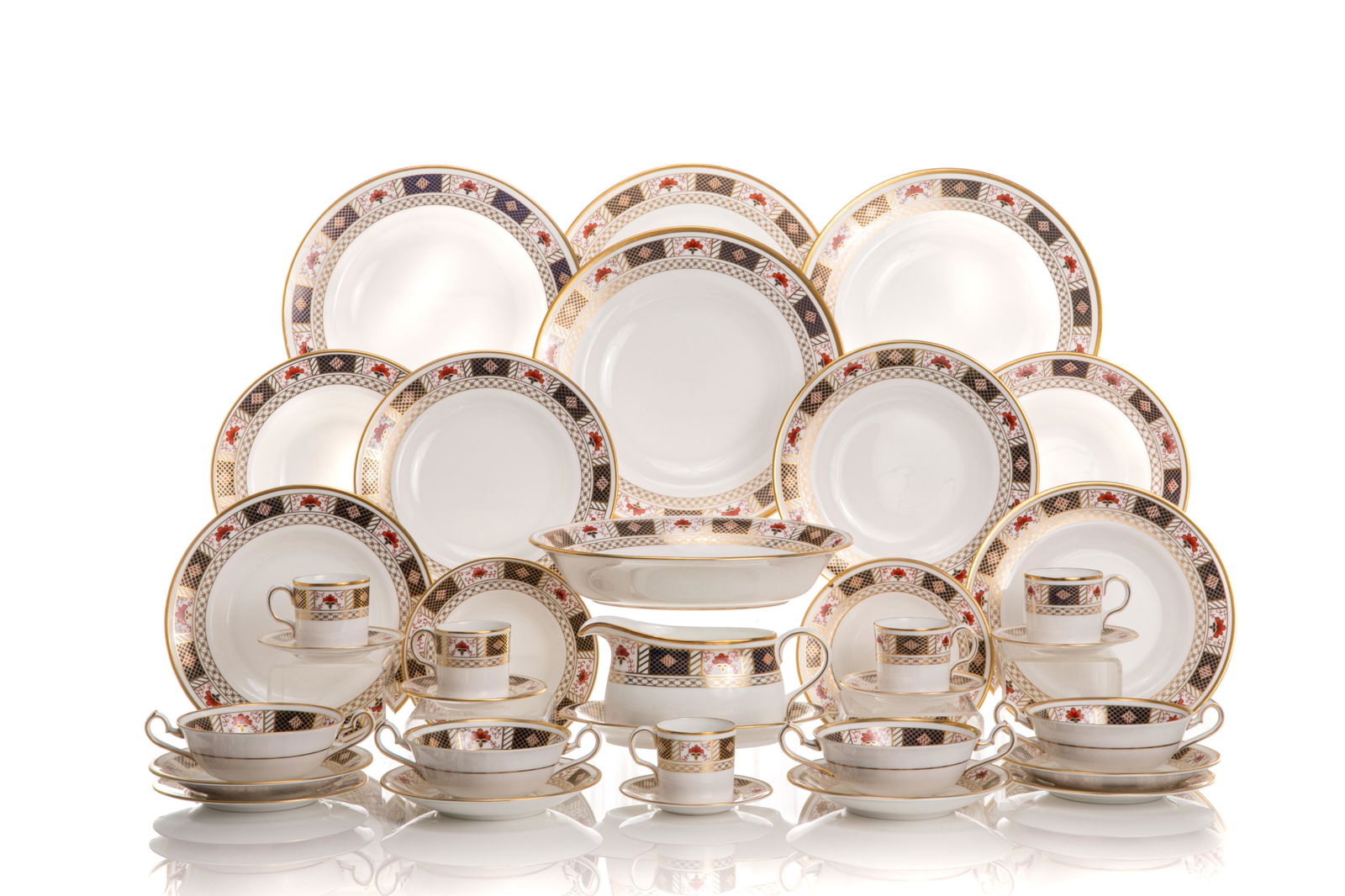 69 PCS ROYAL CROWN DERBY PORCELAIN DINNER SERVICE: In the Derby Border pattern no. A 1253. Including ten dinner plates, ten salad plates, twelve bread and butter plates, twelve cereal coupe bowls, twelve cream soup bowls and saucers, twelve demitasse