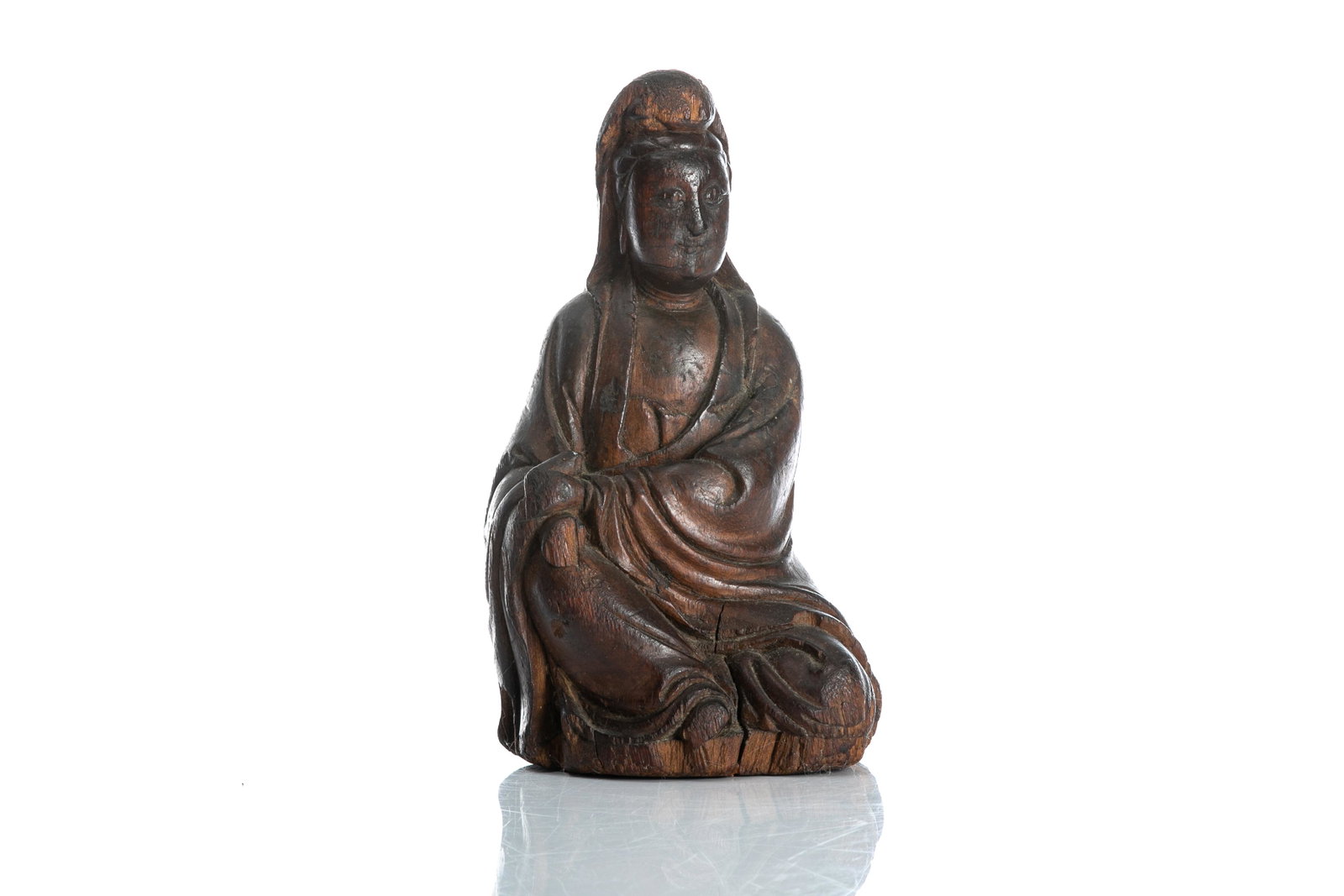 CHINESE MING DYNASTY WOOD GUANYIN FIGURE: Chinese, Ming dynasty, an elegantly carved Guanyin figure seated with right leg raised, nice early patination to the figure. H. 20.5cm (8 in.)